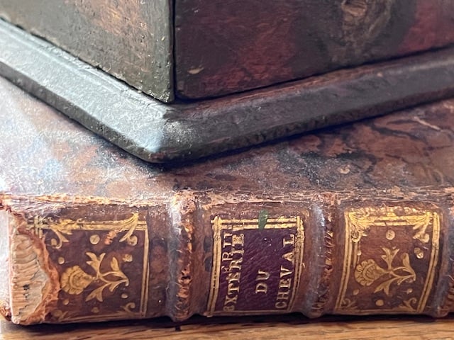 A book beside a coffee grinder, cover art for CONVERSATE